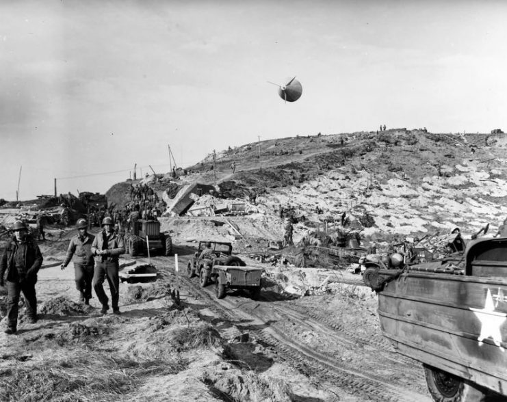 US Army vehicles move inland on Omaha Beach during the early days of the invasion