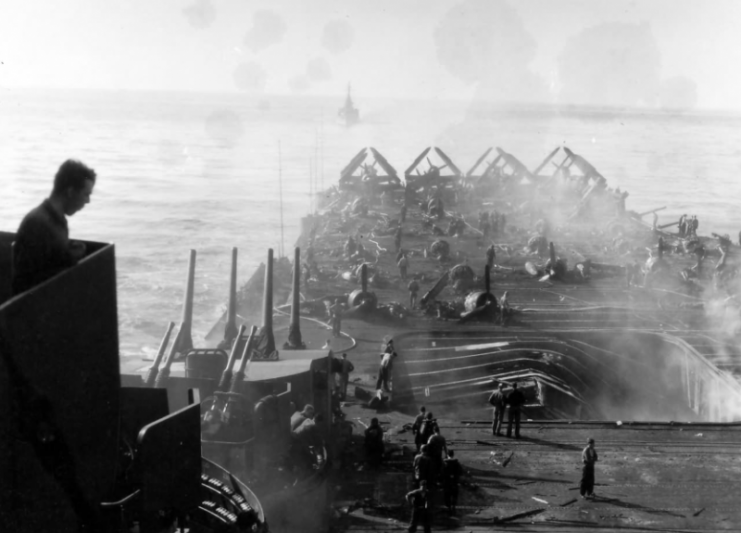 View over the damaged flight deck of USS Bunker Hill (CV-17)