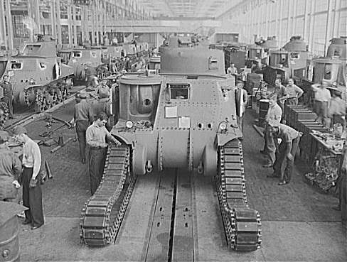 Workers putting tracks on the M3 Lee tanks at Chrysler tank arsenal.