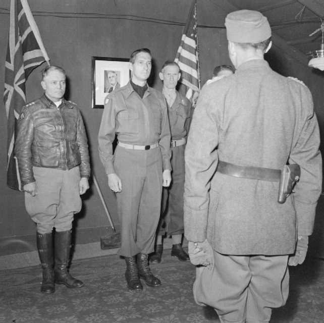 Generalleutnant Fridolin von Senger und Etterlin, the commander of XIV Panzer Corps, meets General Clark, Lieutenant General Sir Richard McCreery and Lieutenant General Lucian K. Truscott, Jr. at 15th Army Group Headquarters, where the Germans received instructions regarding the unconditional surrender of German forces in Italy and West Austria, May 1945.