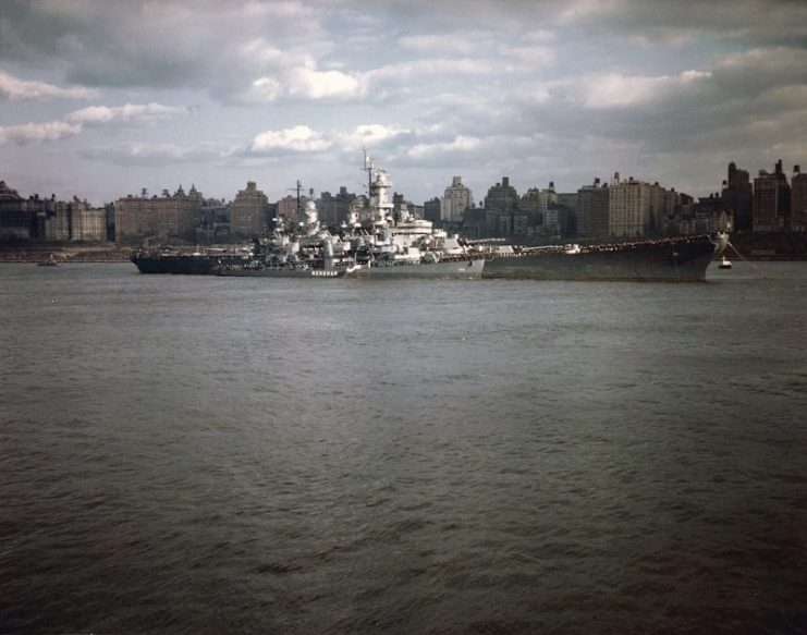 The U.S. Navy battleship USS Missouri (BB-63), with the destroyer USS Renshaw (DD-499) alongside, manning the rails during Navy Day ceremonies in the Hudson River, New York City (USA).