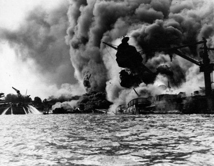 USS Arizona (BB-39) sunk and burning furiously, 7 December 1941.