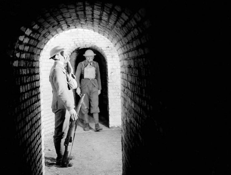 Soldiers of the 51st Highland Division wearing gas masks while on duty in a fort on the Maginot Line in France, November 3, 1939