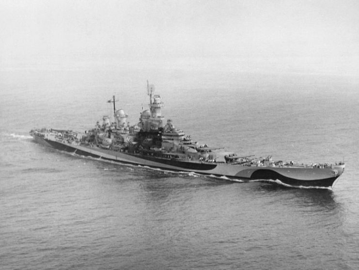 The U.S. Navy battleship USS Missouri (BB-63) during battle practice in Chesapeake Bay on 1 August 1944. She is wearing Camouflage Measure 32 Design 22D.