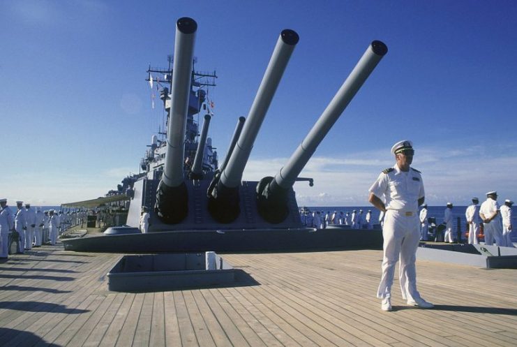 Crew members man the rail as the battleship USS Missouri (BB-63) arrives in port prior to a cruise to Australia and around the world, 1986.