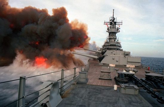 Smoke billows from the muzzles of the Mark 7 16-inch/50-caliber guns in each of the three main gun turrets aboard the battleship USS Missouri (BB-63) after the ship fired multiple salvos during exercise RimPac “90 near Hawaii.