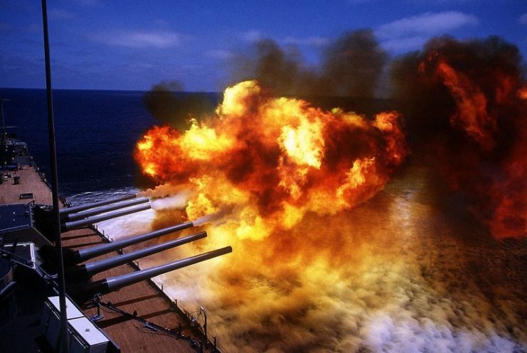 The No. 1 and 2 Mark 7 16-inch/50-caliber gun turrets are fired during a main battery firing exercise aboard the battleship USS Missouri (BB-63). The ship is en route to Sydney, Australia, during a cruise around the world, 1986.