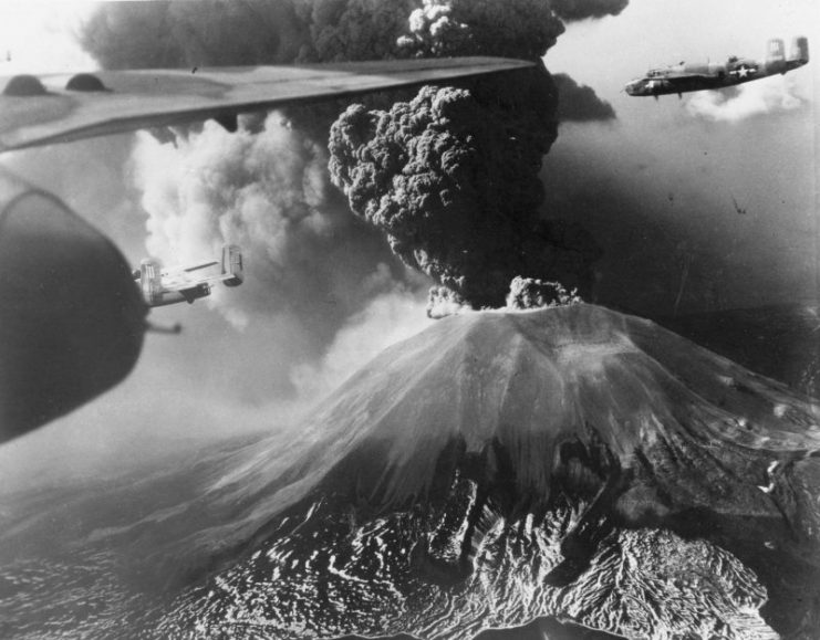 B-25 Mitchell bombers of 321st Bomber Group, US 447th Bomber Squadron flying past Mount Vesuvius, Italy during its eruption of 18-23 March 1944.