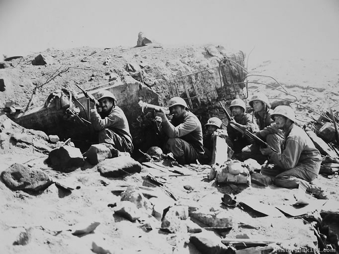 Riflemen from 3rd Battalion, 23rd Marines fire on the enemy from a destroyed Japanese pillbox. Iwo Jima – February 1945