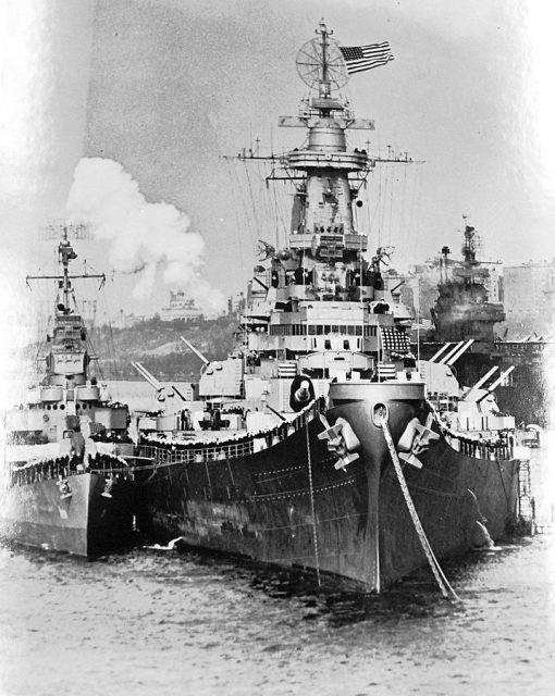 USS Renshaw (DD 499) dwarfed in comparison, stands alongside USS Missouri (BB 63) to pipe President Harry S. Truman onboard for Navy Day luncheon, October 1945
