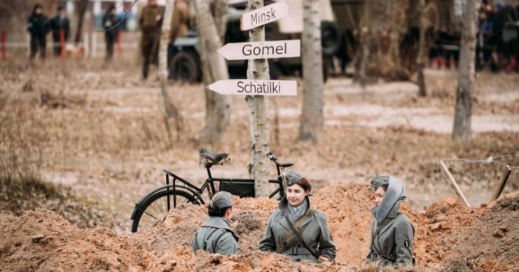 Three Unidentified Women Reenactors Dressed As German Wehrmacht