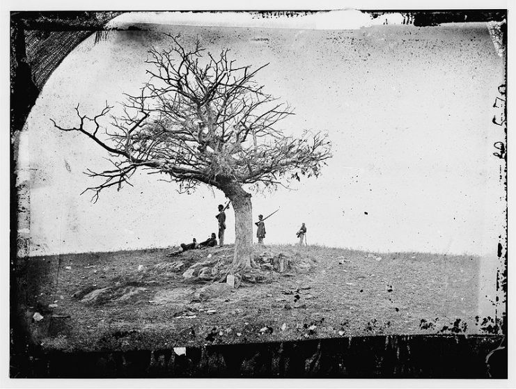 “A Lonely Grave”; title chosen by photographer Alexander Gardner for his shot of Union soldiers standing near a comrade’s grave at the battlefield of Antietam, September 1862