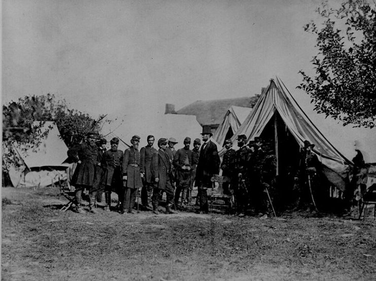 President Lincoln visiting the battlefield at Antietam, Md. (October 3, 1862). General McClellan and 15 members of his staff are in the group.