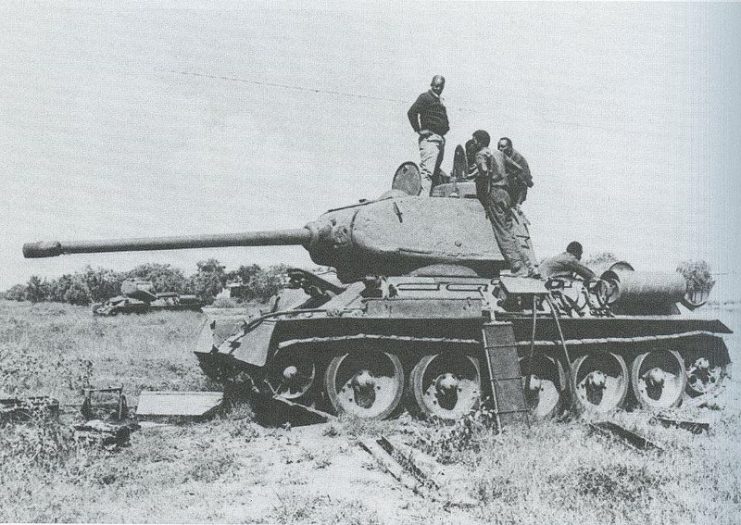 A heavily damaged Somali National Army T-34 going through repairs.