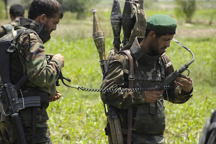 Afghan National Army soldiers transport rocket propelled grenades found during an air assault mission in support of Operation Champion Sword in Sabari, Afghanistan, July 31, 2009.