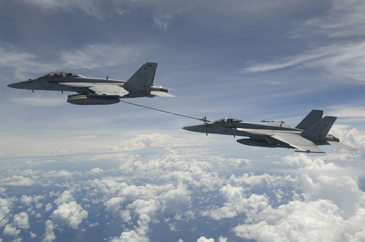 An F/A-18F refueling an F/A-18E over the Bay of Bengal, 2007