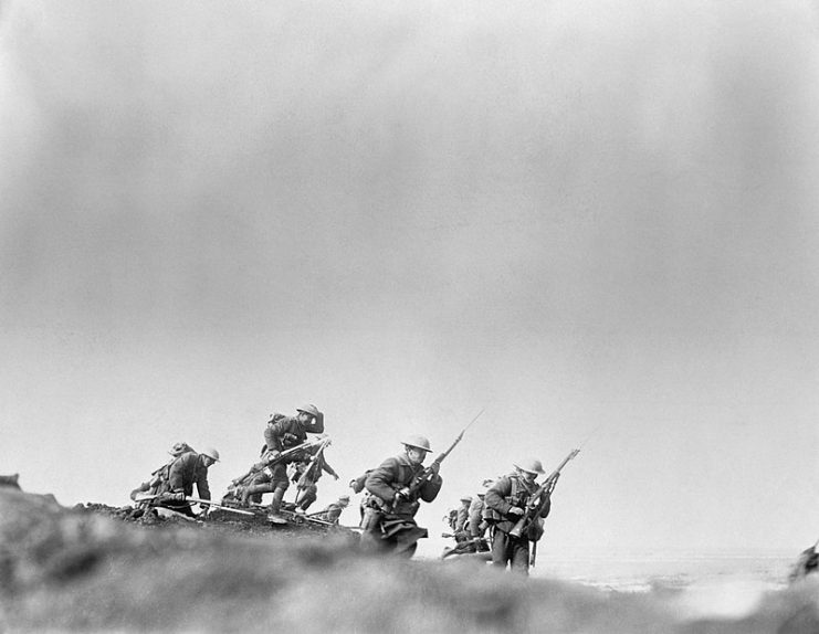 Staged scene of Canadian soldiers leaving their trench for a raid during the Battle of the Somme.