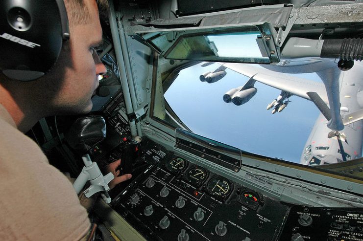 A boom operator of a KC-135 Stratotanker during an aerial refueling of a B-52 Stratofortress in Afghanistan