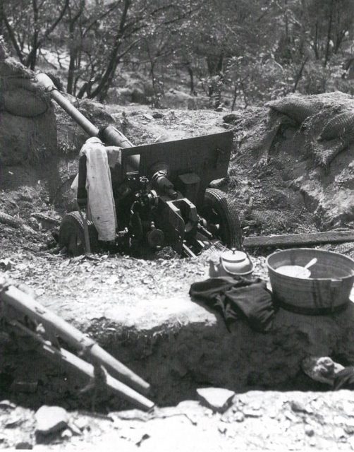 An abandoned Soviet-made North Korean ZiS-3 on a hill overlooking Incheon harbor after its capture by United Nations forces during the amphibious landings at Incheon in mid-September 1950.