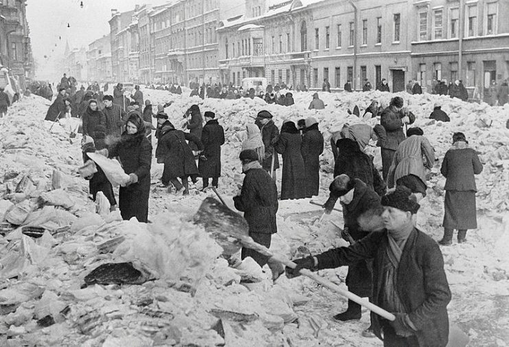 Leningradians cleaning the street after the first winter in the besieged city. By RIA Novosti archive CC BY-SA 3.0