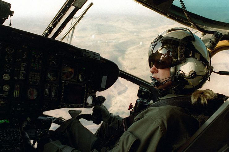 Captain Sarah Deal, the first female Marine Corps helicopter pilot, flies a CH-53 Sea Stallion helicopter from HMH 466, MCAS Tustin, California, over Camp Pendleton while training during Exercise KERNEL BLITZ ’97