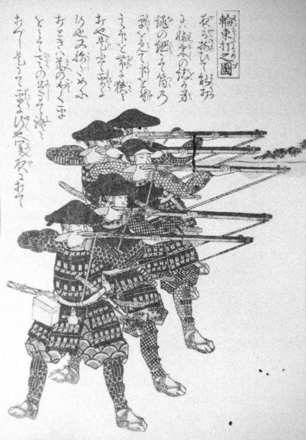 Japanese foot soldiers (ashigaru) firing hinawaju (matchlocks). Night-shooting practice, using ropes to maintain proper firing elevation.