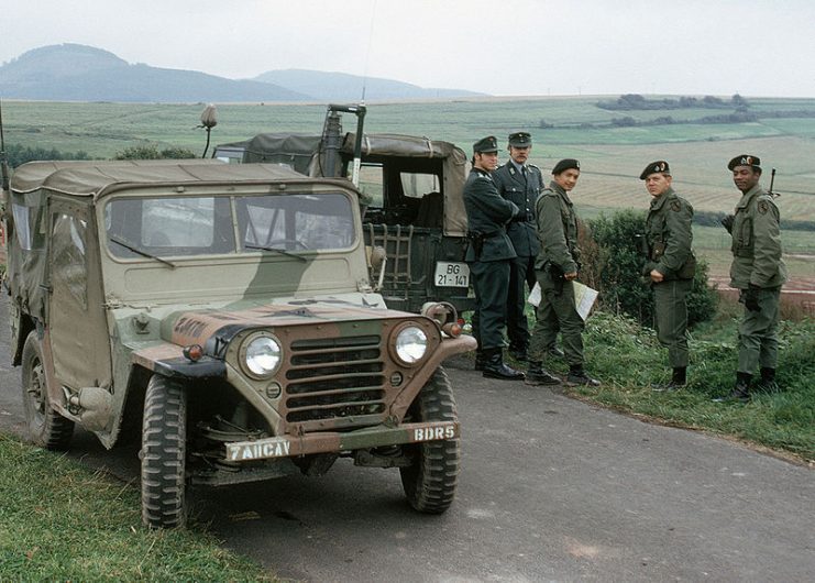 Group of three American soldiers, their M151, and two West German Bundesgrenzschutz officers, 1979.