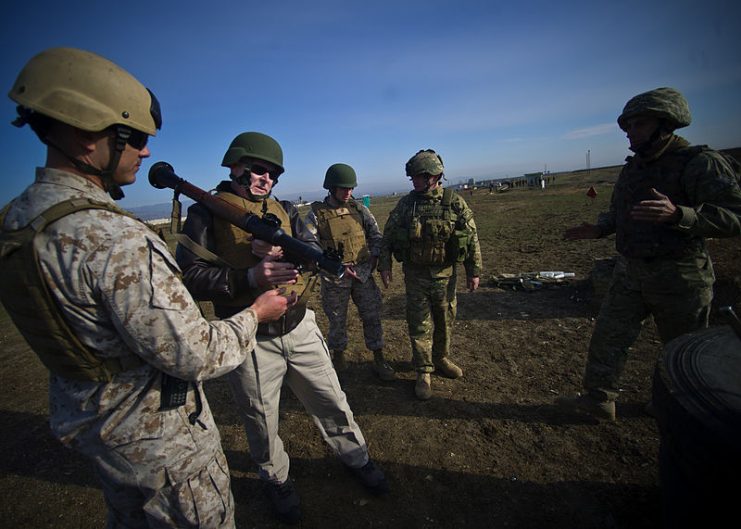 Marine Corps Staff Sgt. Bow Mattioda demonstrates the proper firing of an RPG-7