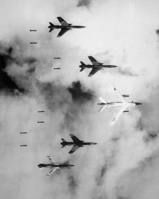 A U.S. B-66 Destroyer and four F-105 Thunderchiefs dropping bombs on North Vietnam during Operation Rolling Thunder