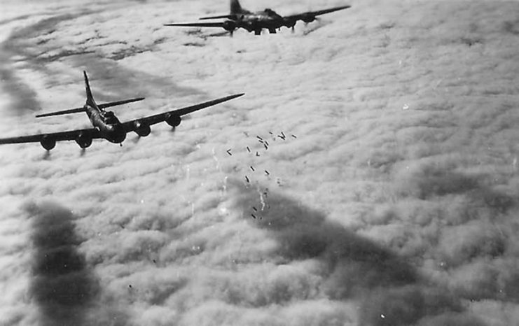 Aerial View of B-17 Bombers Dropping Bombs Over Target