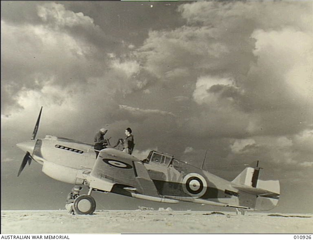 Armourers working on a Tomahawk Mk.II from No. 3 Squadron RAAF in North Africa, 23 December 1941.