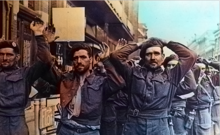 British prisoners at Arnhem Bridge. They are unshaven after four days of fighting – water was scarce during the battle. Photo: Bundesarchiv, Bild 183-S73820 : CC-BY-SA 3.0