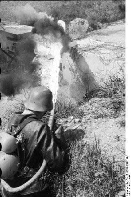 A German soldier operating a flamethrower in 1944. By Bundesarchiv Bild CC-BY-SA 3.0