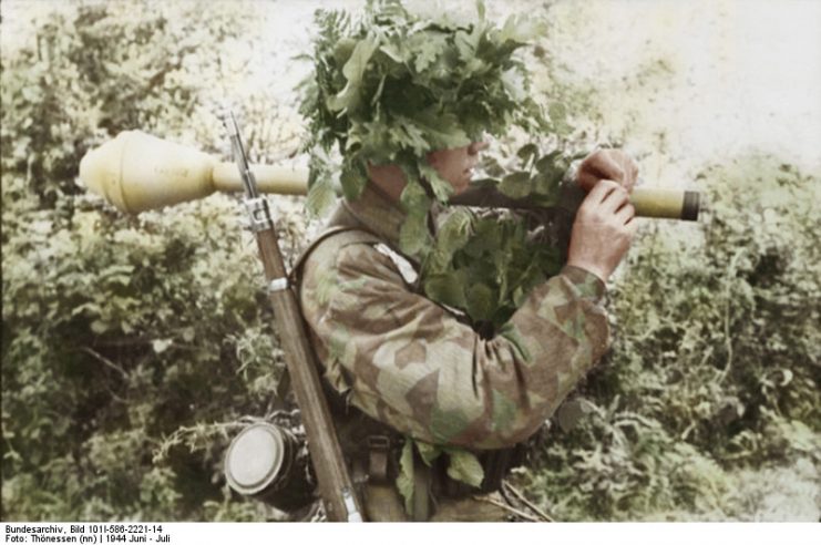 A Paratrooper In Normandy with camouflage. By Thönessen and Bundesarchiv Bild CC-BY-SA 3.0