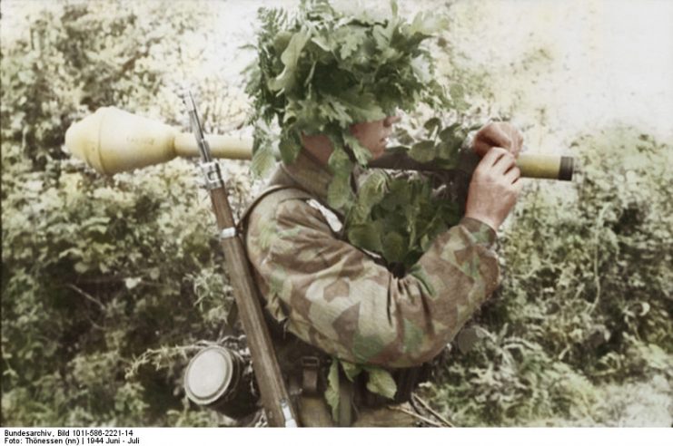 A Paratrooper In Normandy with camouflage. By Thönessen and Bundesarchiv Bild CC-BY-SA 3.0