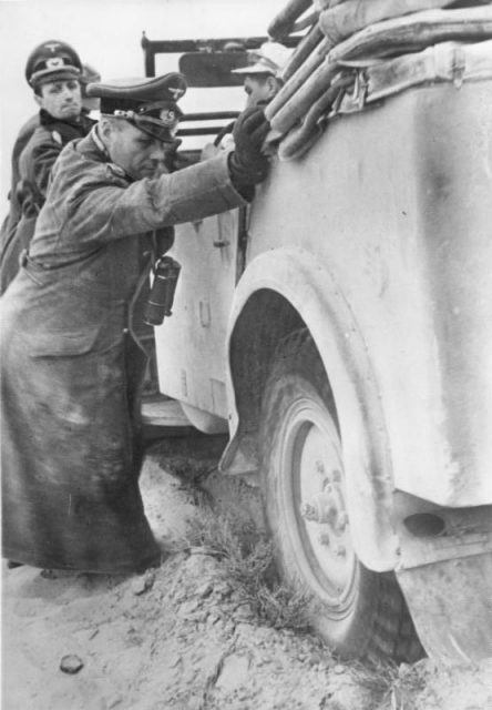 Rommel helping to free up his staff car. By Bundesarchiv Bild CC-BY-SA 3.0