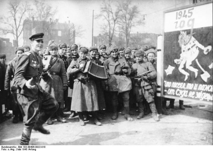 Soviet soldiers celebrating the surrender of the German forces in Berlin, 2 May 1945. By Bundesarchiv Bild CC-BY-SA 3.0
