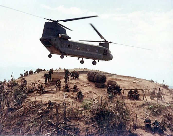 Troops unload from a CH-47 helicopter in the Cay Giep Mountains, Vietnam, 1967.