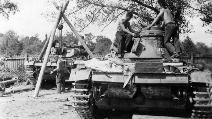 Crew atop a Panzer III 5