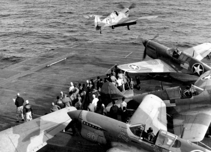 Curtiss P-40F Warhawks of 33rd FG take off from USS Chenango CVE-28 carrier. Operation Torch North Africa