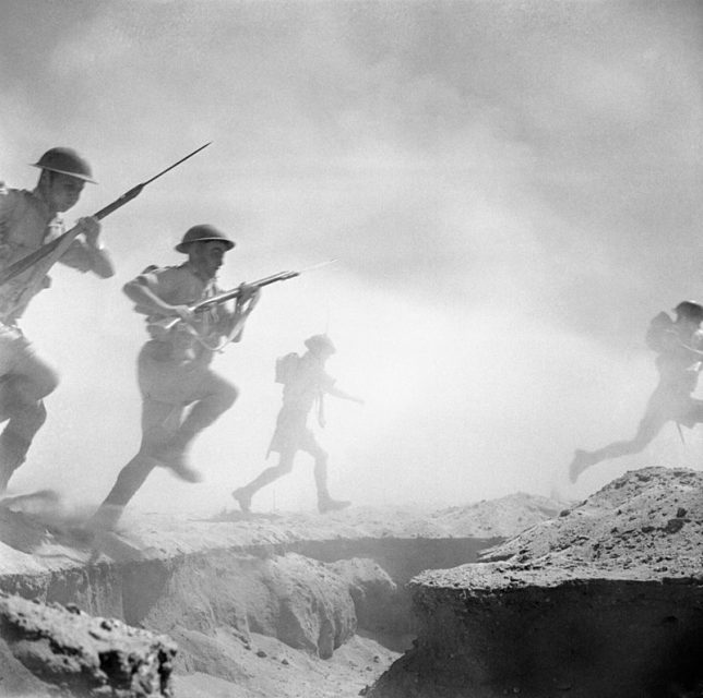 El Alamein 1942- British infantry advances through the dust and smoke of the battle.