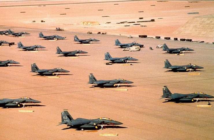 F-15E Eagle fighter aircraft of the 4th Tactical Fighter Wing, Seymour Johnson Air Force Base, N.C., are parked on an air field during Operation Desert Shield.