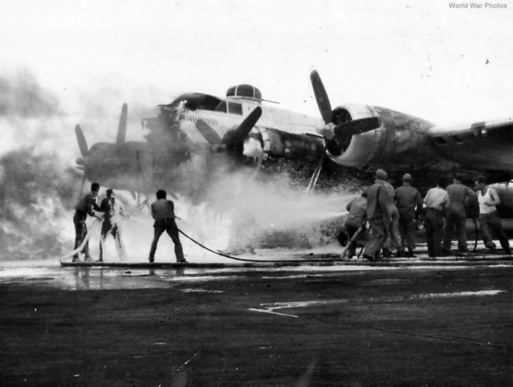 Firefighters working to save B-17 of 8th AF England, 1944.