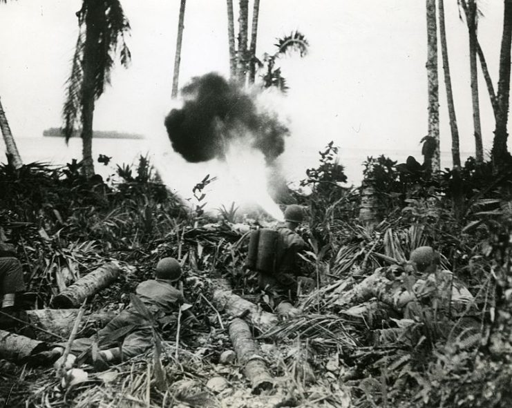Flame throwers used to break down resistance in Japanese fortifications are shown being used by United States troops in the Southwest Pacific.