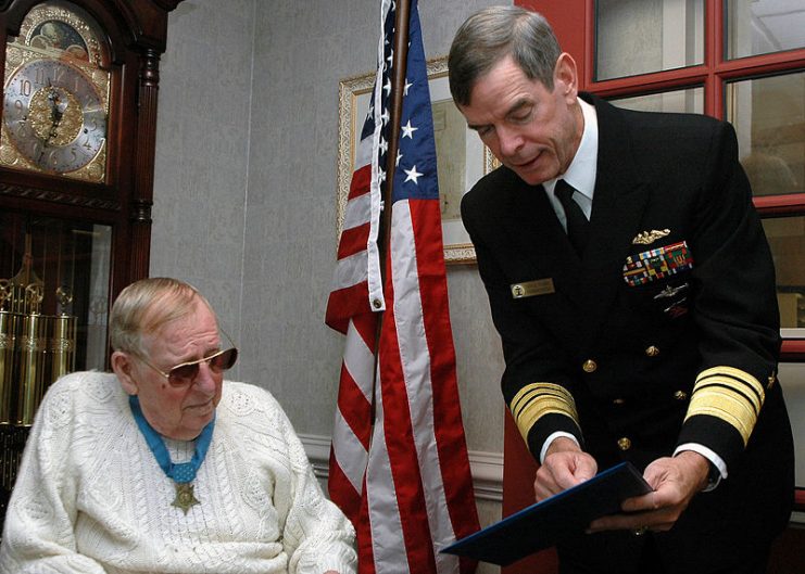 Fluckey, at left, being visited by Vice Admiral Charles Munns in 2006