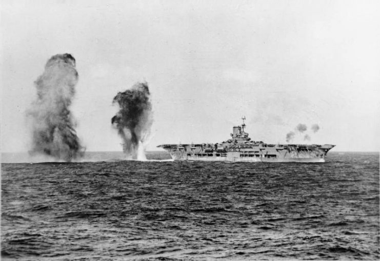 Bombs falling astern of Ark Royal during an attack by Italian aircraft during the Battle of Cape Spartivento.