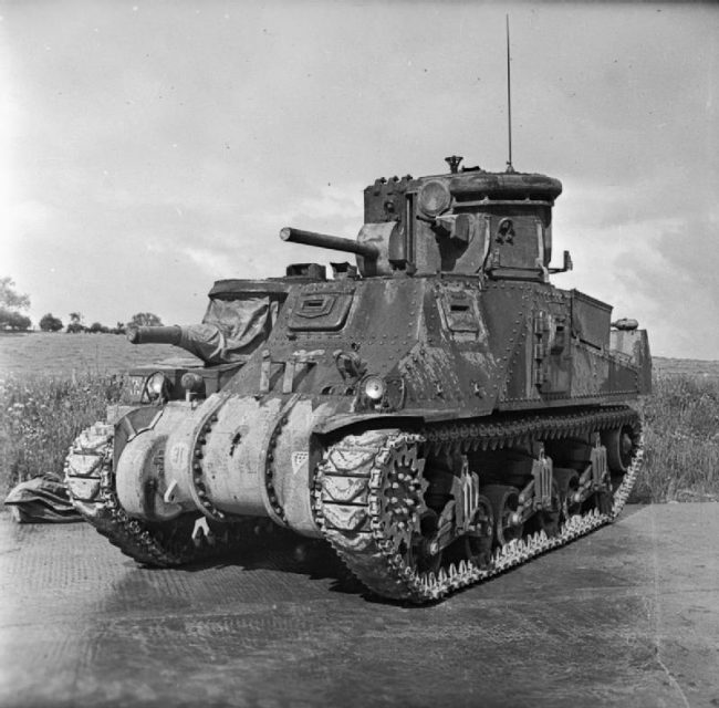 An M3 tank fitted with an armoured searchlight turret, known as a Canal Defense Light. IWM Collection description is “Grant CDL (Canal Defence Light) with searchlight and dummy gun mounted in turret.”