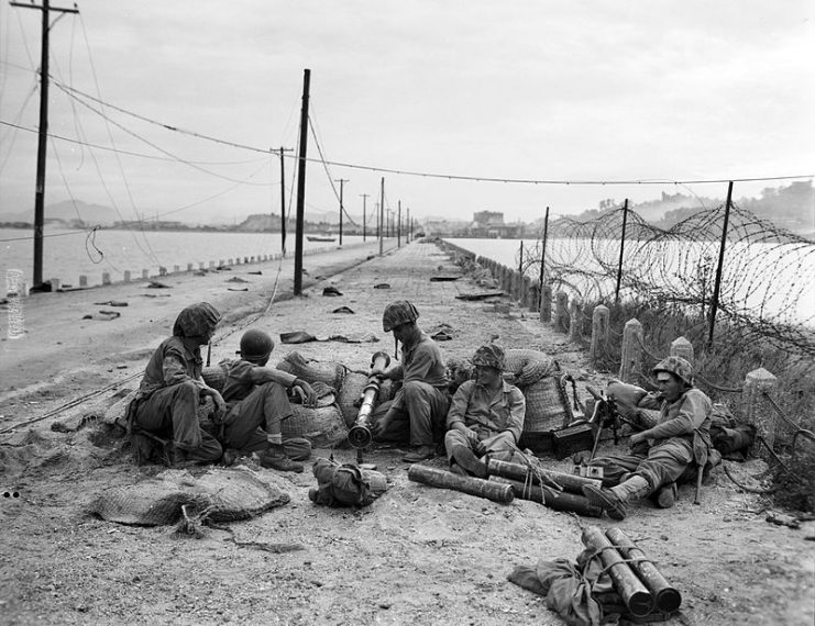 Marines with a bazooka and machine gun set up a security post against possible tank counter-attack