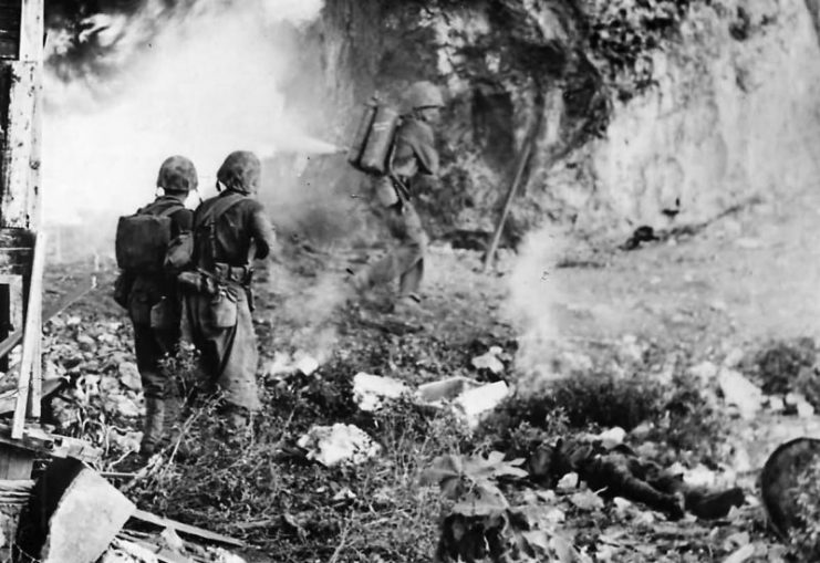 Marines Clear Japanese Cave with flame-thrower on Okinawa.