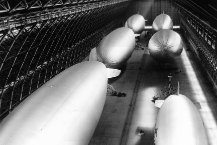 A view of six helium-filled blimps being stored in one of the two massive hangars located at NAS Santa Ana, during World War II.
